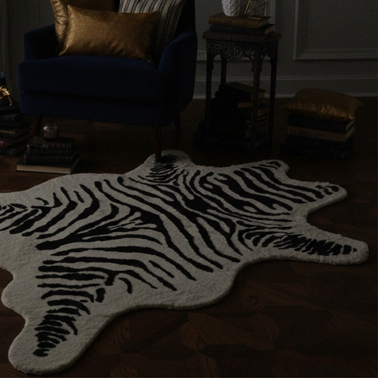 Zebra print rug in a dimly lit room with furniture.